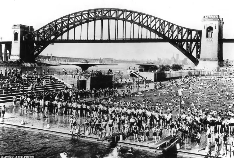  Astoria public pool with the Hell Gate railroad bridge