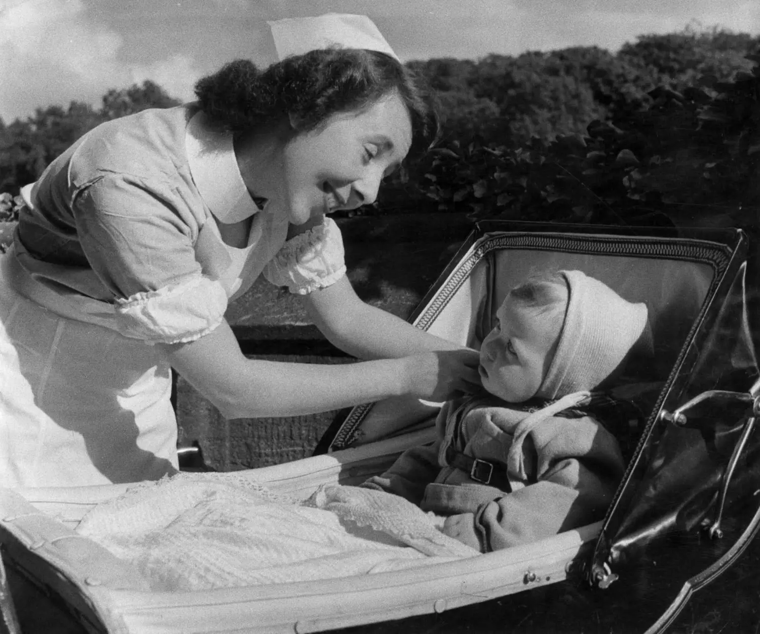 A nurse attends to a child. 