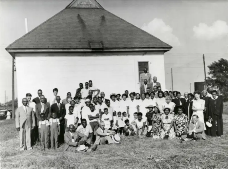 African-American congregation in front of a church
