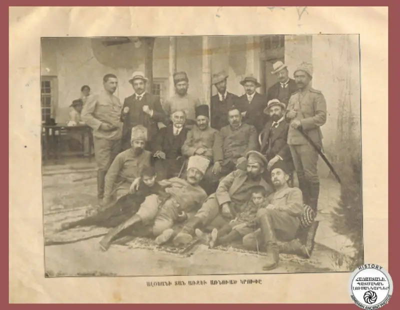 The coffin in front of Aloyan's house, including members and officials