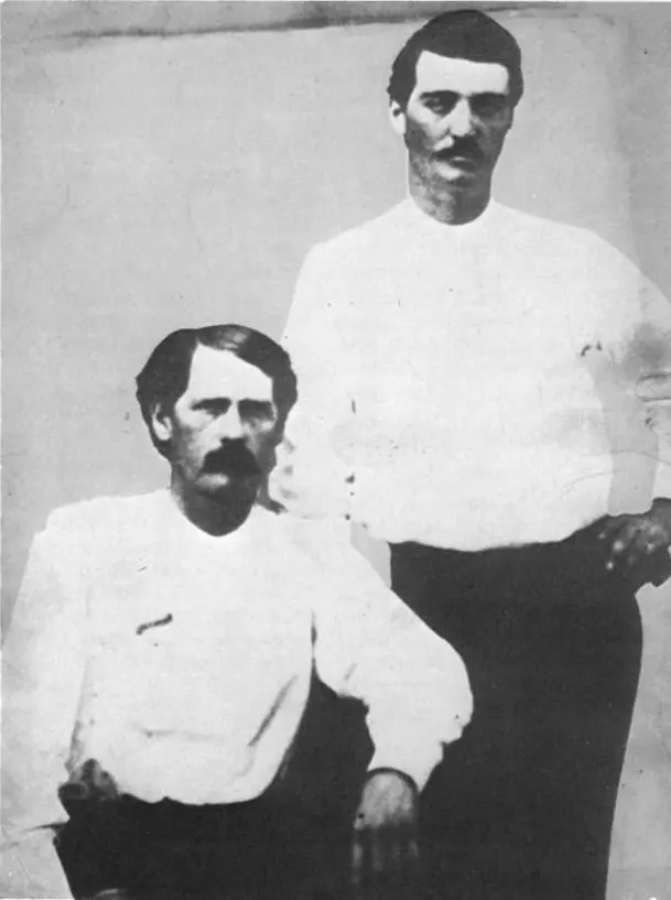 Deputies Bat Masterson (standing) and Wyatt Earp