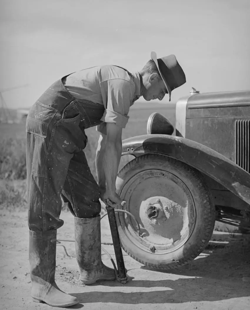 A farmer pumping 
