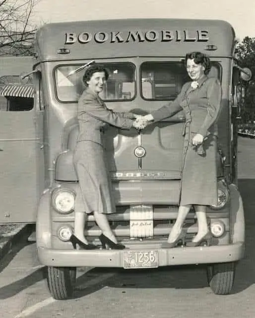 A Time Capsule from 1951 Two Bookmobile staff members posing next to their mobile library. Ohio, USA.
