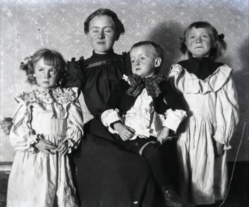 Portrait of mother with three children