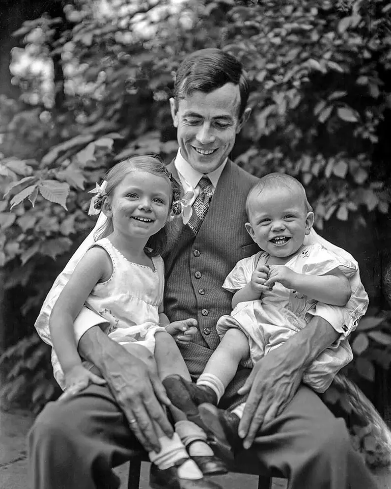 A dad with his children.