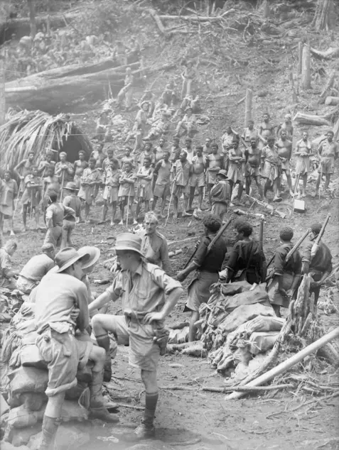 Australian soldiers and native carriers Australian soldiers and native carriers