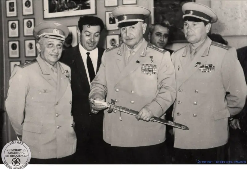 Marshal Hovhannes Baghramyan holds the sword of Zoravar Andranik