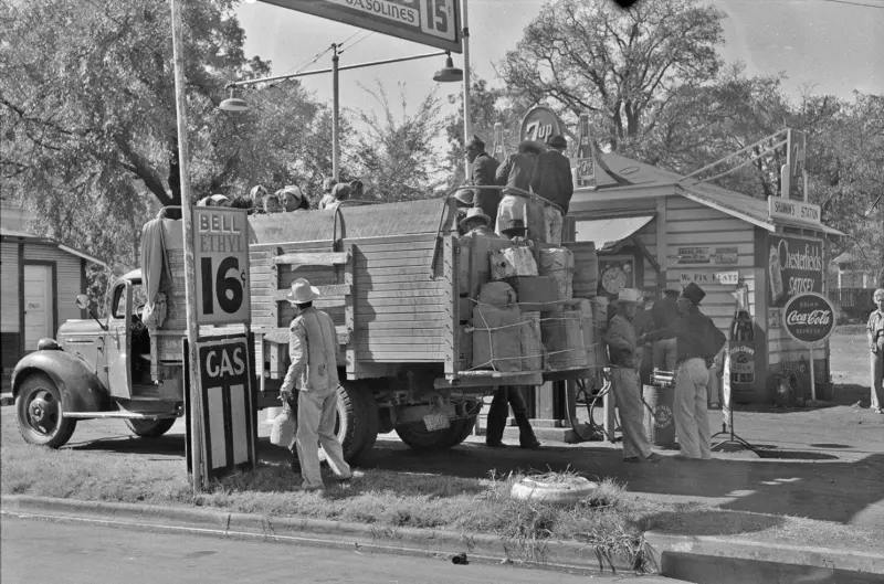 A group of migrant farm workers returning from picking cotton in Mississippi. 