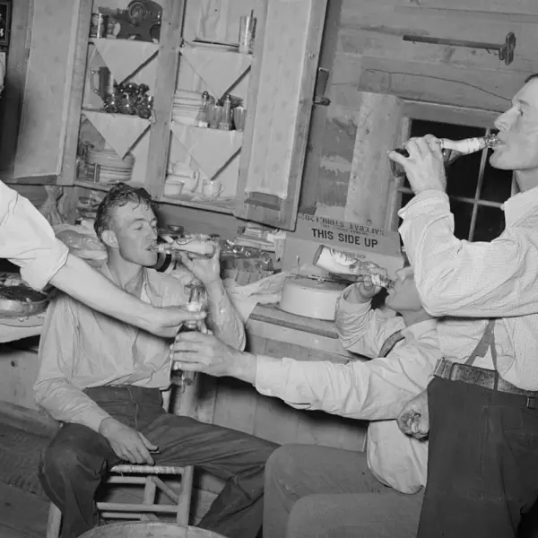 Men enjoying their bottle of beer 