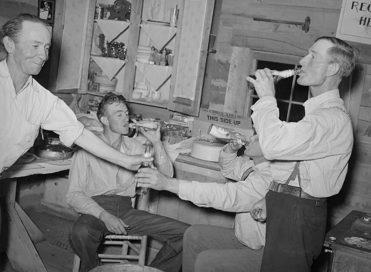 Men enjoying their bottle of beer 