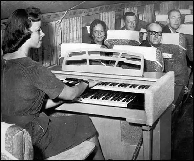 An Organist Entertaining First Class Passengers on a Plane