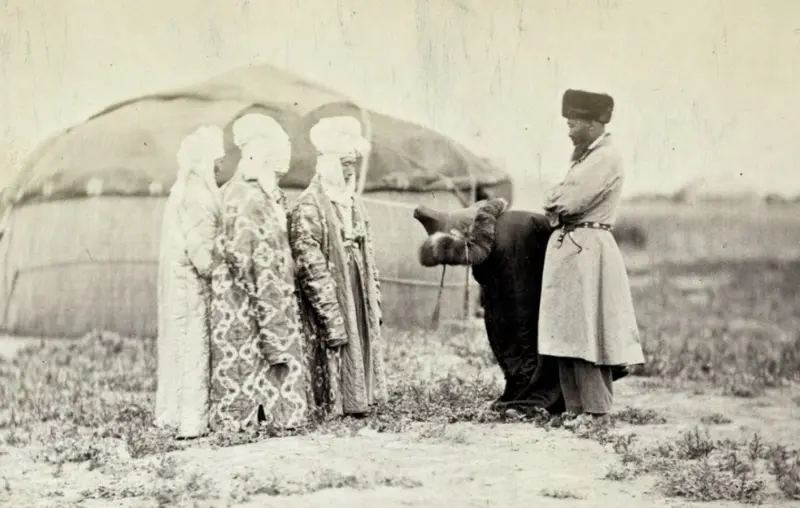 A Kyrgyz groom inspects a bride