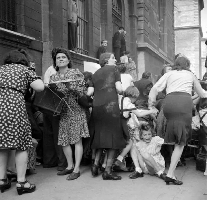 Women protecting Children from Sniper Fire in Paris, 1944