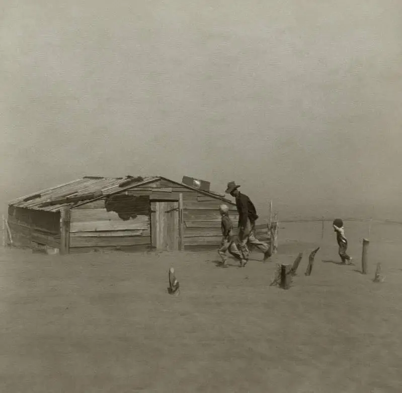 Farmer and sons walking in the face of a dust storm.