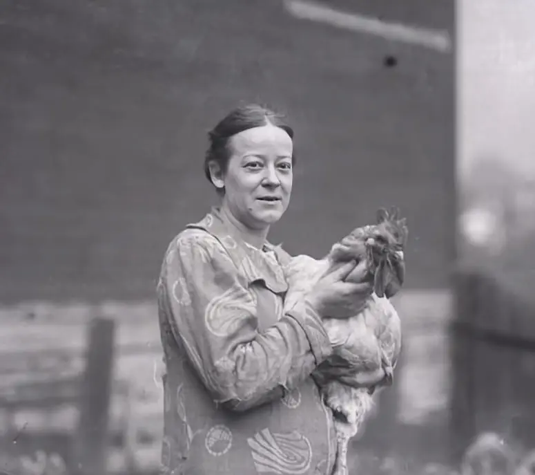 Woman Holding Rooster.