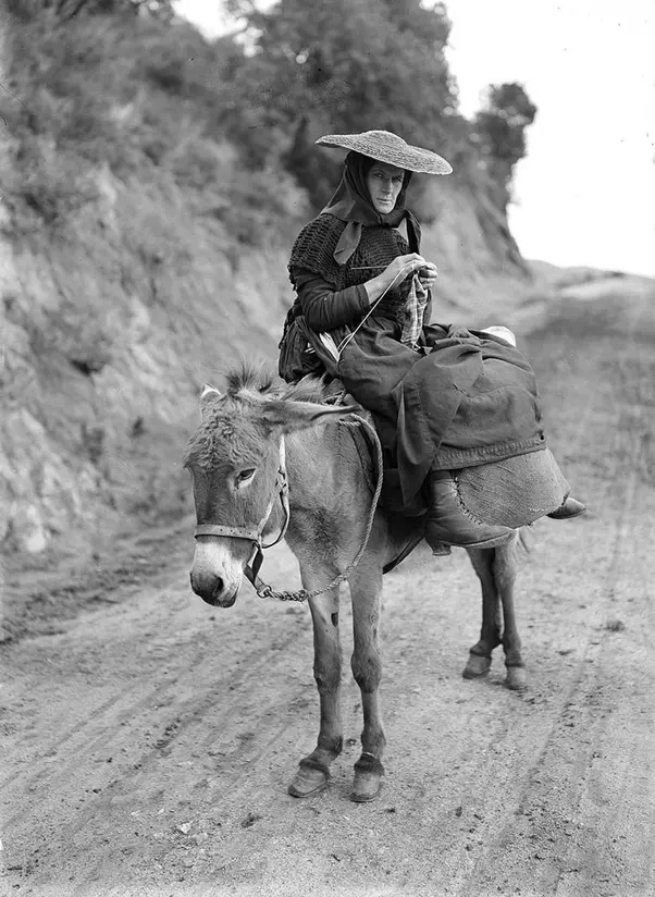 Woman traveling by donkey