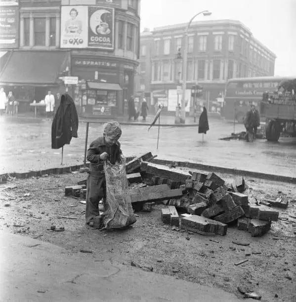 Little Benny Merrell aged six takes some of the ancient wood bricks 