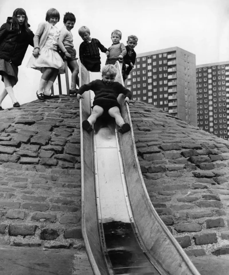 Sliding down a metal slide