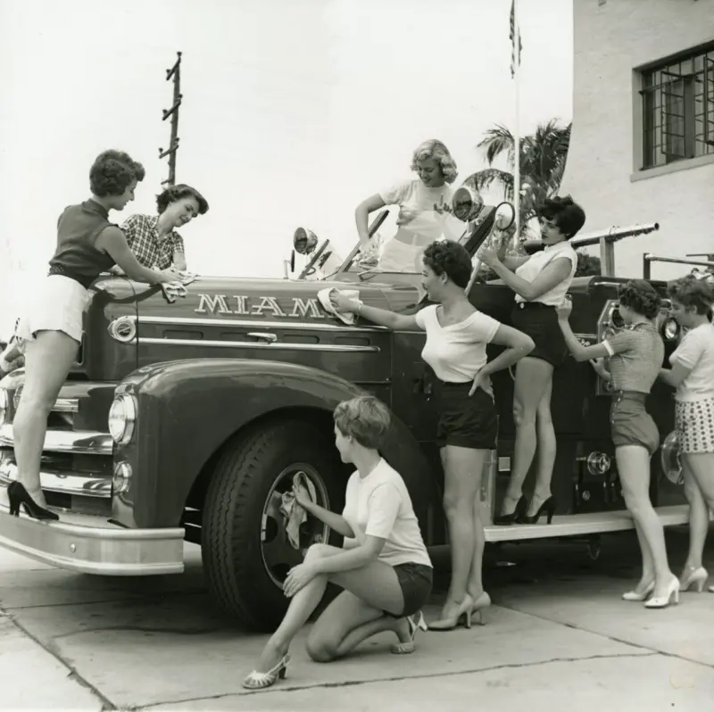 Pin-up models wash the Miami Beach fire department car
