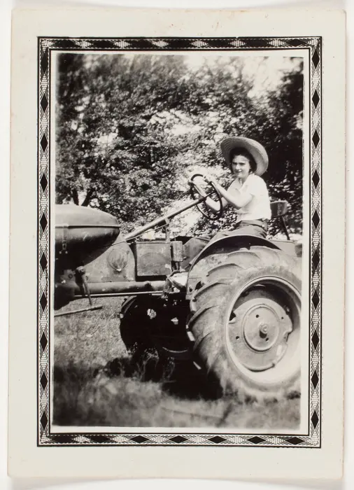 Young woman driving a tractor