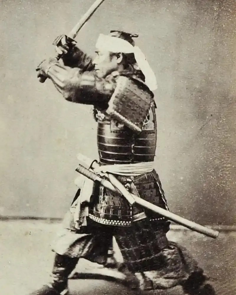 Kubota Sentarô in armour wielding a sword