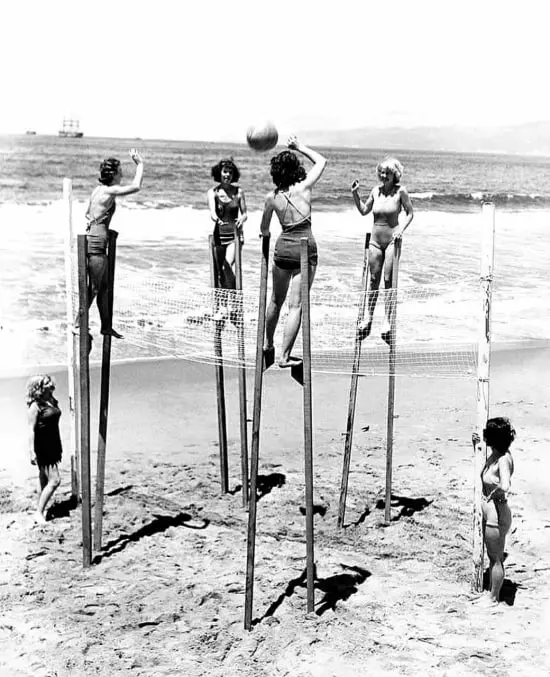 Girls Play Volleyball on Stilts