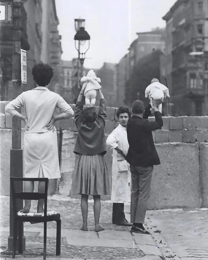 Residents of West Berlin show their children