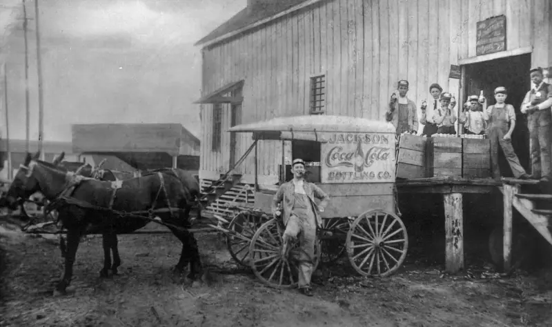 Coca-Cola delivery wagon.
