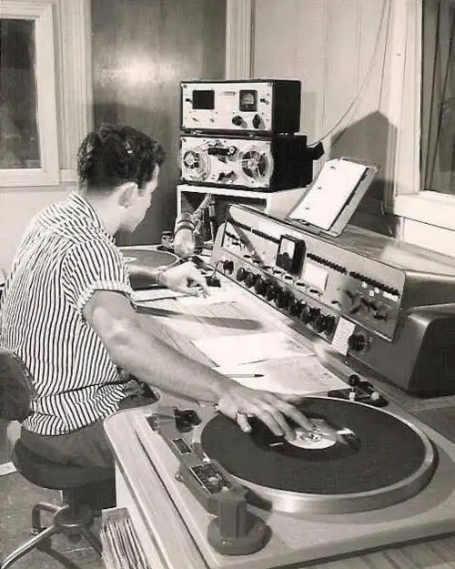 A disc jockey at work 