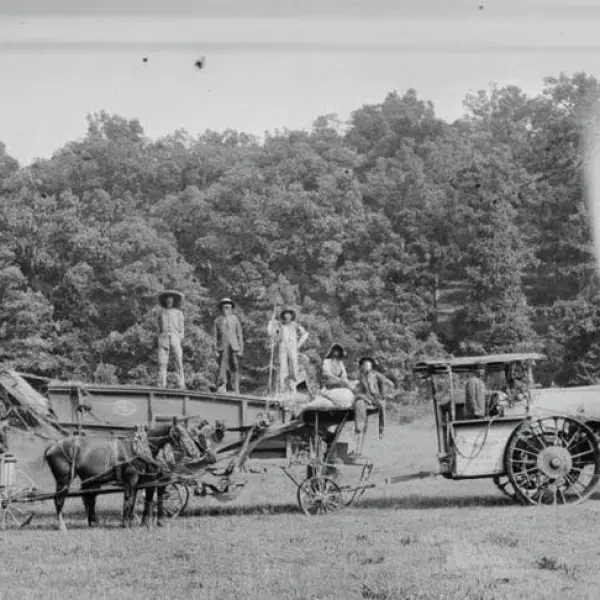 Farm crew with steam tractor