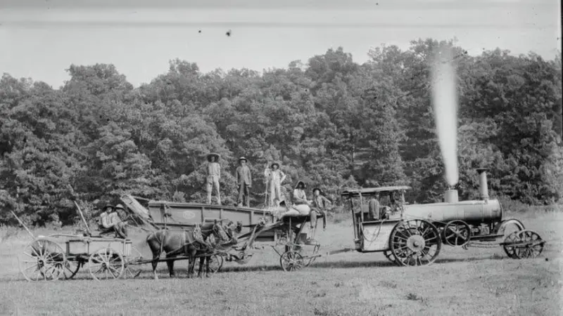 Farm crew with steam tractor