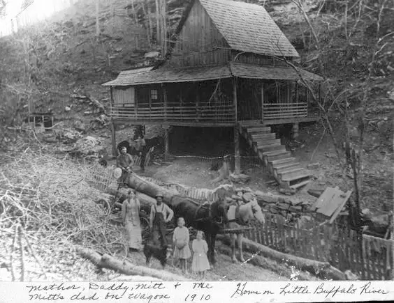 A family at their rustic homestead on the Little Buffalo River