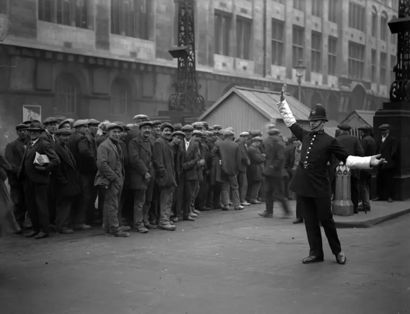 Tram workers queue up for their pay at the tram subway in Kingsway, High Holborn