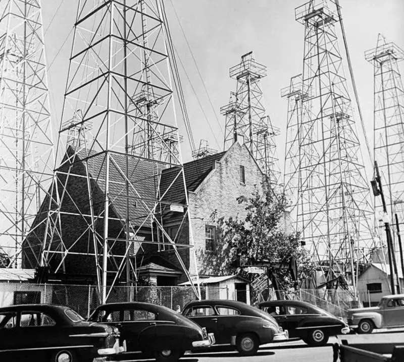 A church surrounded by derricks