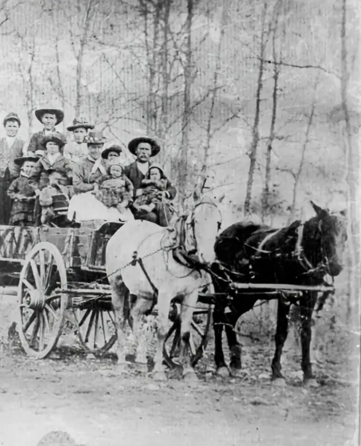 The Mathews family is piled into a wagon.