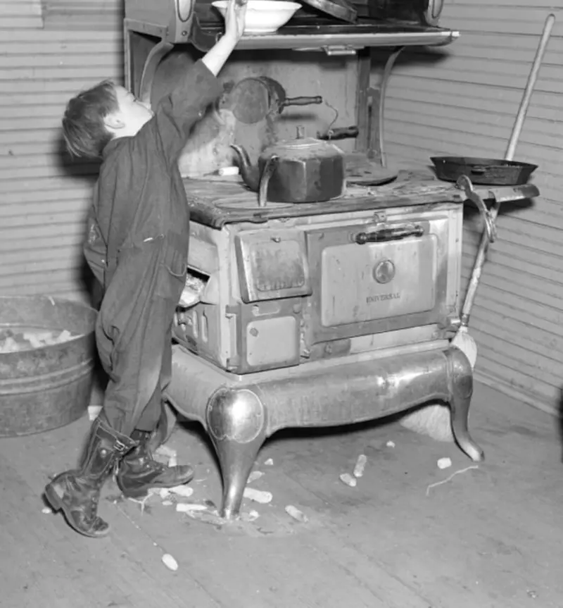 A child reaches for a bowl