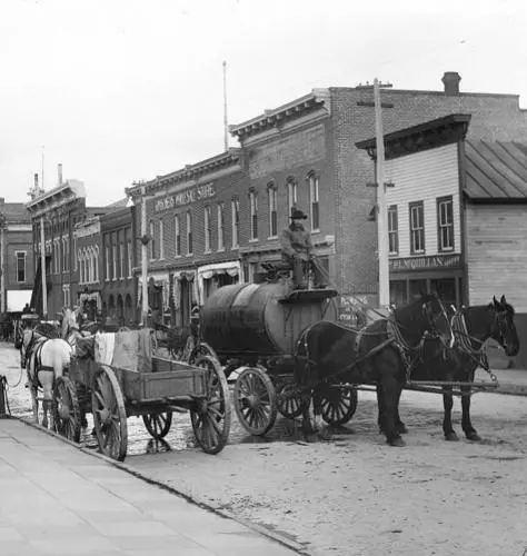 Horse-drawn wagons, including a water wagon