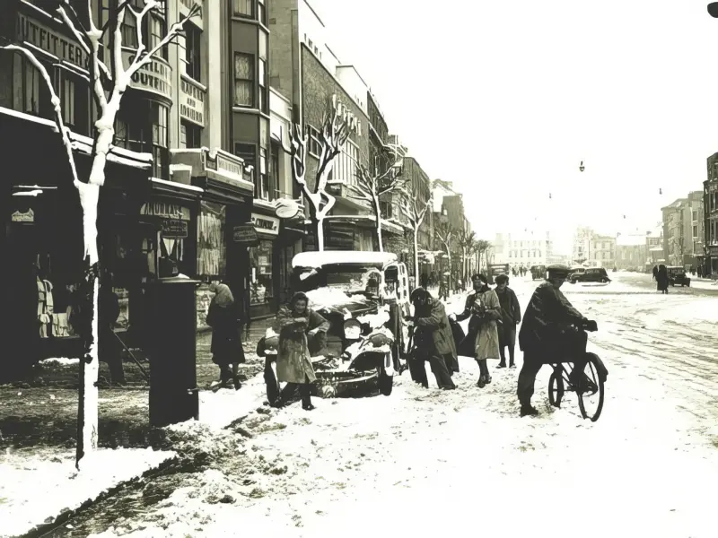 People enjoying the snow on Grand Parade