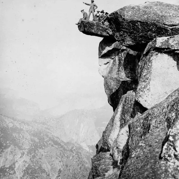 Tourists post for a death-defying photo