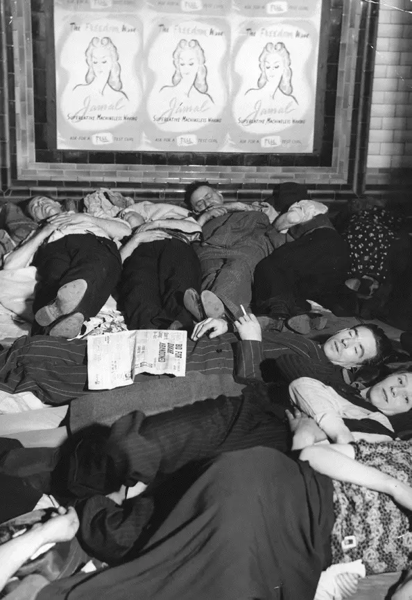 People asleep on the escalators at Piccadilly Tube Station