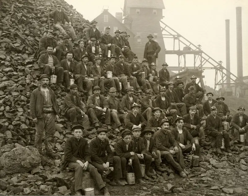 Miners pose with lunch pails in hand