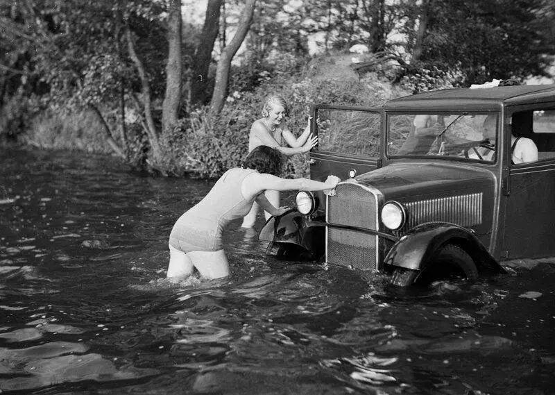 Women Pushing a Car Out of Water