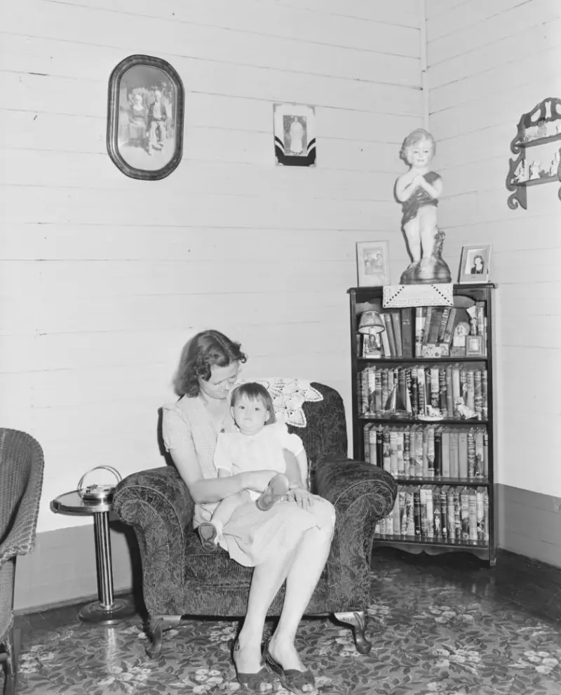 A miner’s wife with their child 