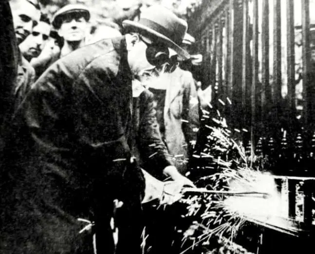 Soviet Ambassador Cuts Bars of USSR Embassy for Metal