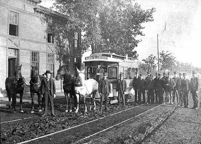 A horse-drawn streetcar stopped on 6th St. and 8th Ave