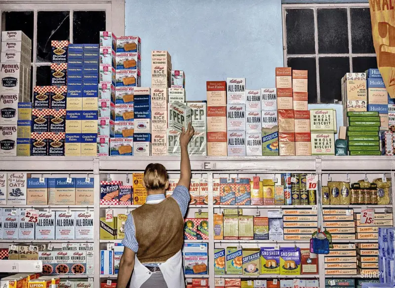 Placing packaged goods on display rack 