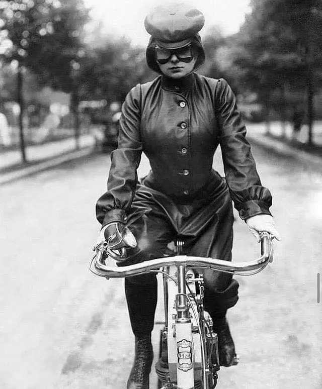 A woman in motorcycling clothing