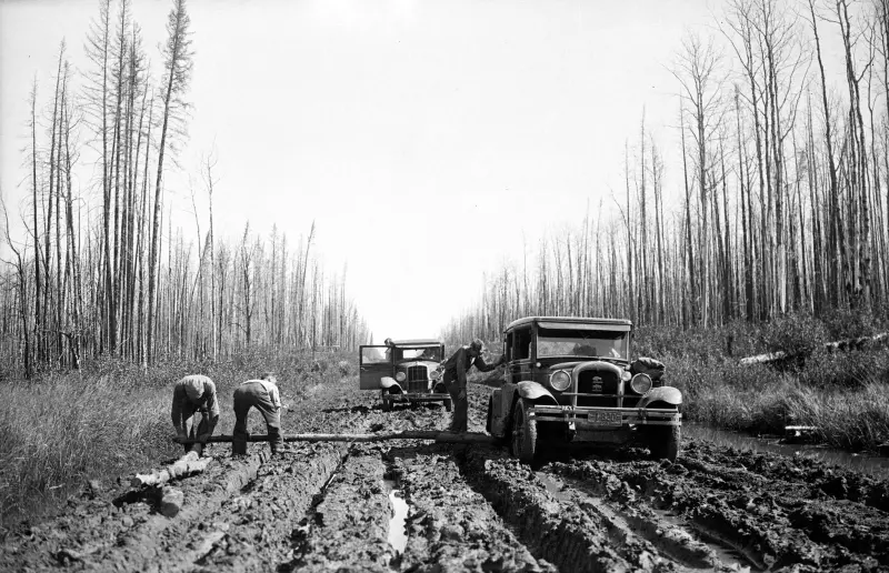 Automobiles in mud on the Monkman Pass Highway