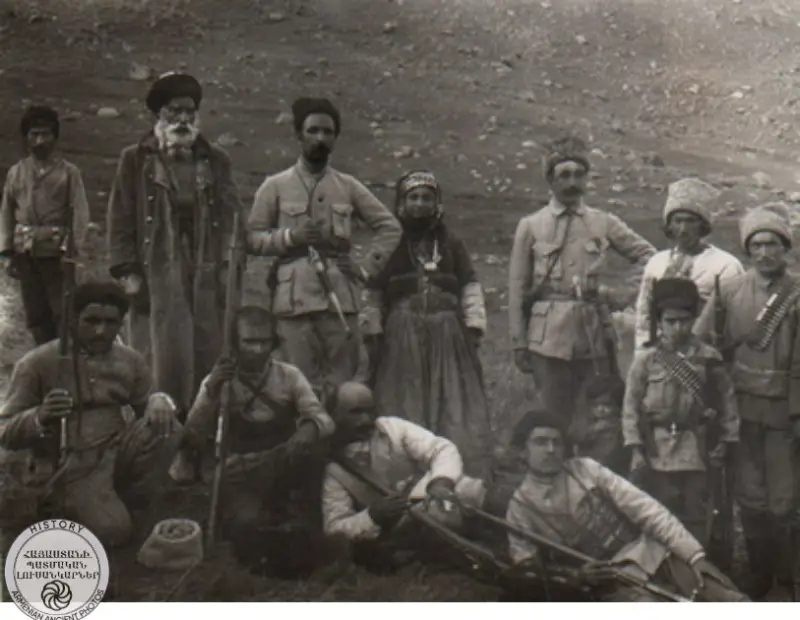 A group of Armenian volunteers, a woman stands in the center