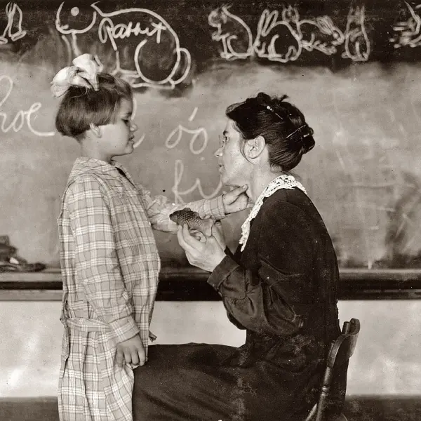 Teaching a deaf-mute to talk.